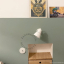 Round white porcelain light switch.
