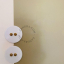 Round white porcelain light switch.