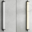 Tubular lamp made of glass and stainless steel.