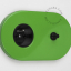 Green and black outlet & switch with black pushbutton.