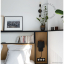 Black or white porcelain bowtie wall or ceiling light with brass arm.