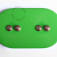 Ovale green light switch with 4 brass pushbuttons.