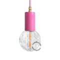 Pink pendant light with exposed light bulb.