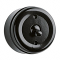 Surface mount black bakelite toggle switch.