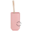 Pink porcelain toilet brush holder.