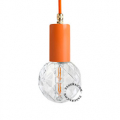Orange pendant light with exposed bulb.