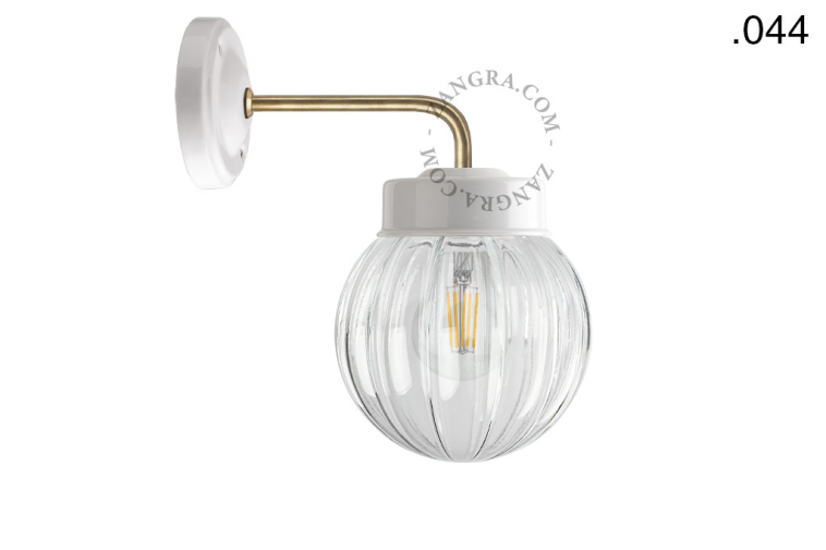 Retro white porcelain wall light with glass shade.