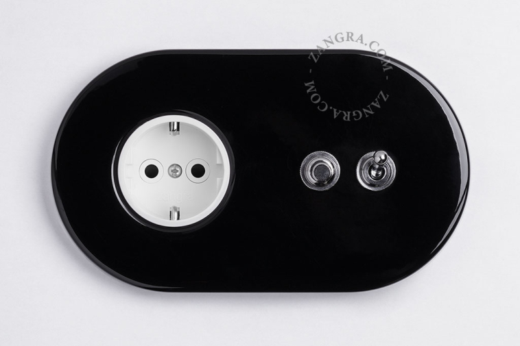 Black flush mount outlet & switch with nickel-plated toggle & pushbutton.