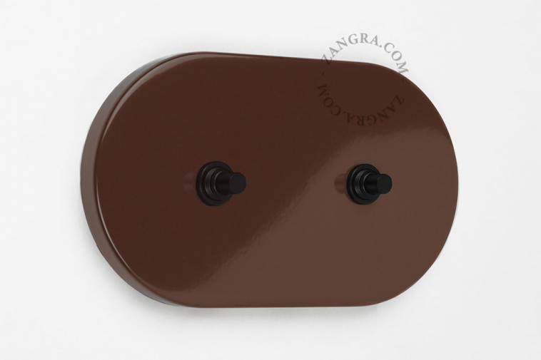Large brown double pushbutton switch.