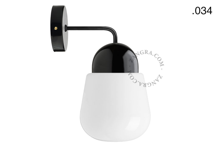 Black porcelain wall light with glass shade.