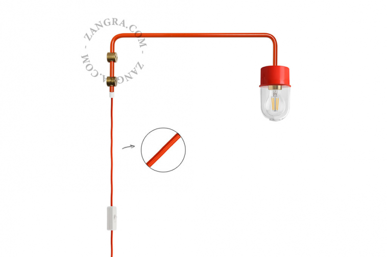 Red wall lamp with swing arm.
