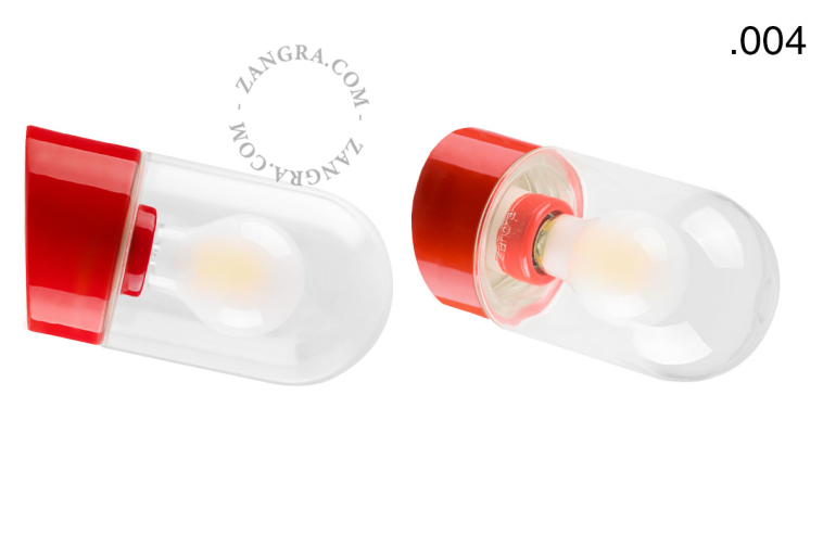 Red porcelain wall light with glass lampshade.
