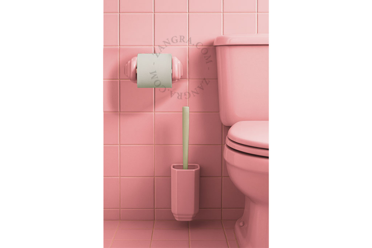 Pink porcelain toilet brush holder.