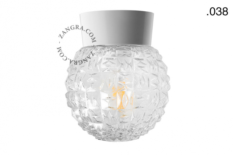 Lampe blanche avec globe en verre.