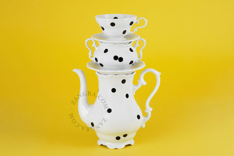 Black dot porcelain cup.