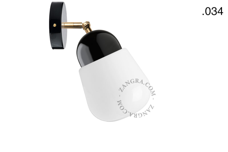 Black porcelain adjustable wall light with glass shade.