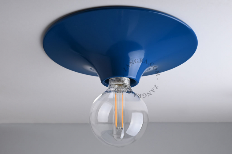 round blue wall or ceiling light