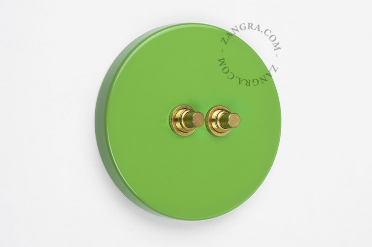 Round green & brass double pushbutton.