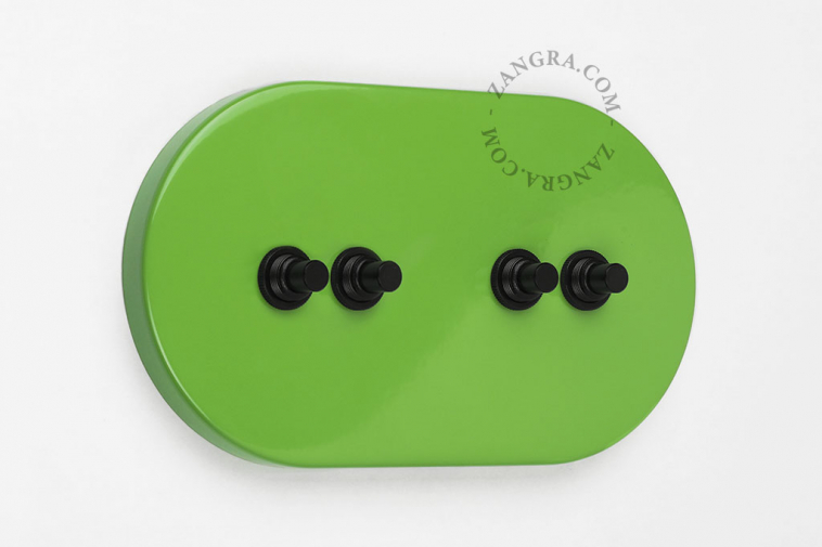 Large green switch with 4 black pushbuttons.