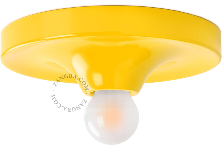 Rund gul lampe.