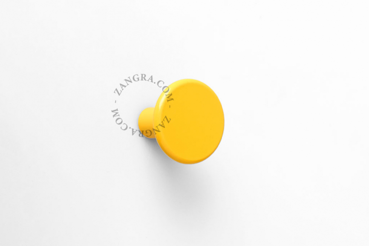 round yellow wall hook or door knob