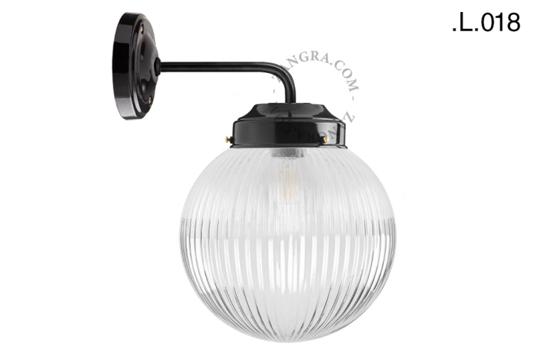 Black retro wall light schoolhouse style with glass shade.