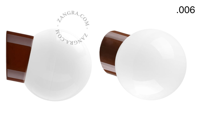Brown porcelain wall light with glass lampshade.