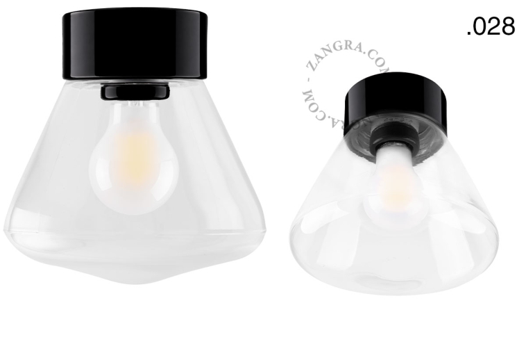 Zwarte porseleinen lamp met glazen schroefkap.