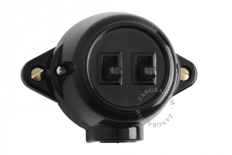 Surface-mount double black toggle switch.