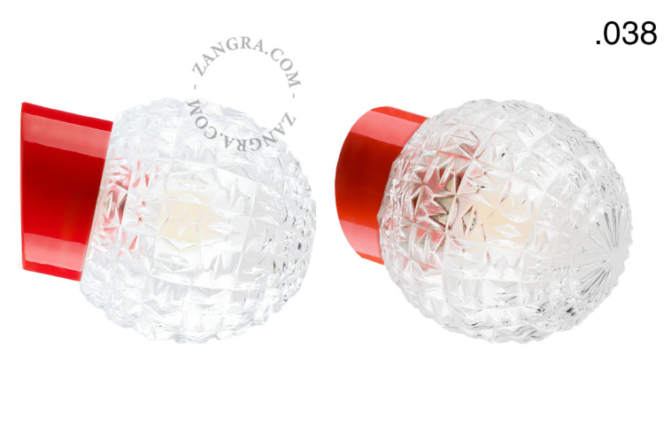Red porcelain wall light with glass lampshade.