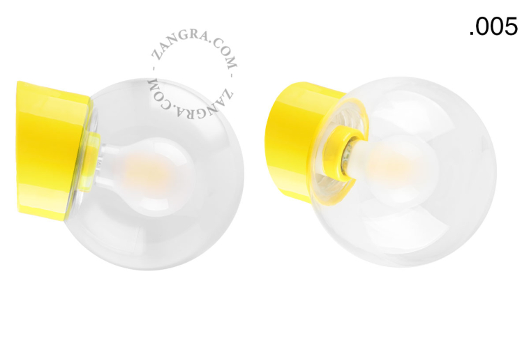 Yellow porcelain wall light with glass lampshade.