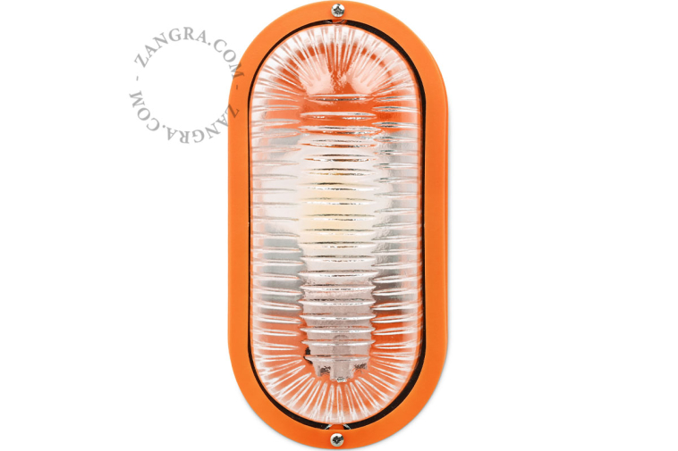 Oval orange bulkhead light.