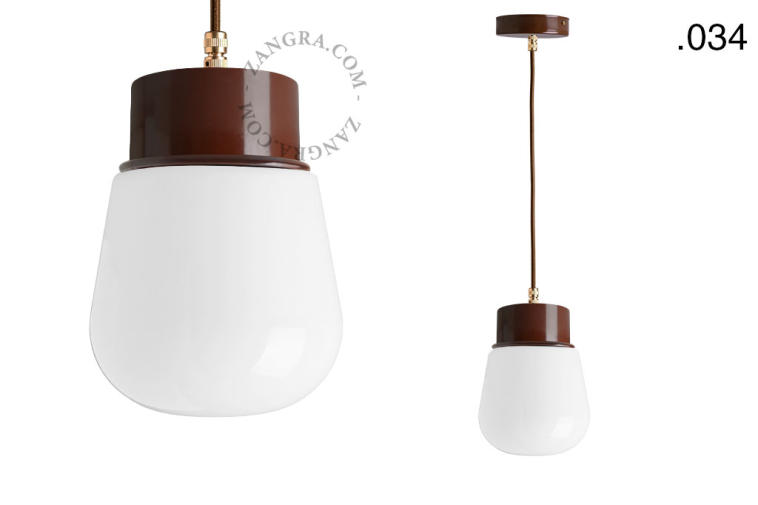 Brown pendant light with glass shade.