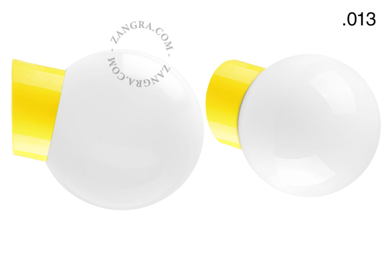 Yellow porcelain wall light with glass lampshade.