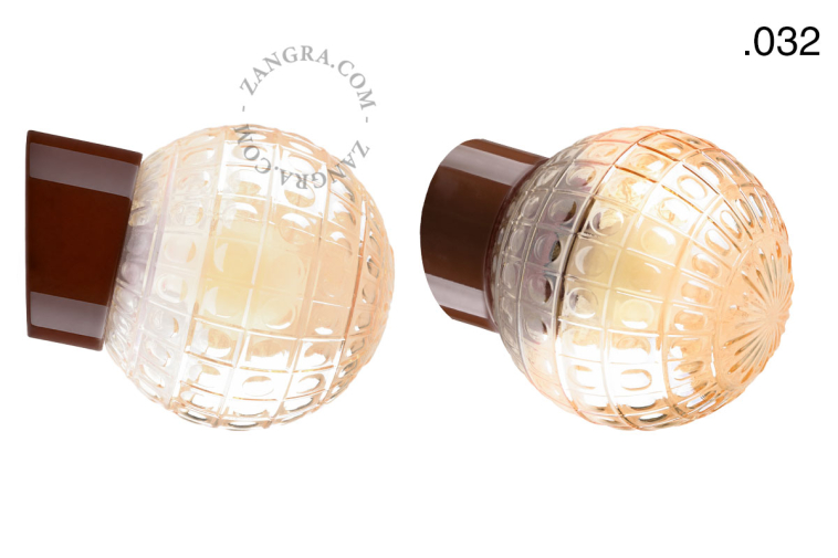 Brown porcelain wall light with glass lampshade.