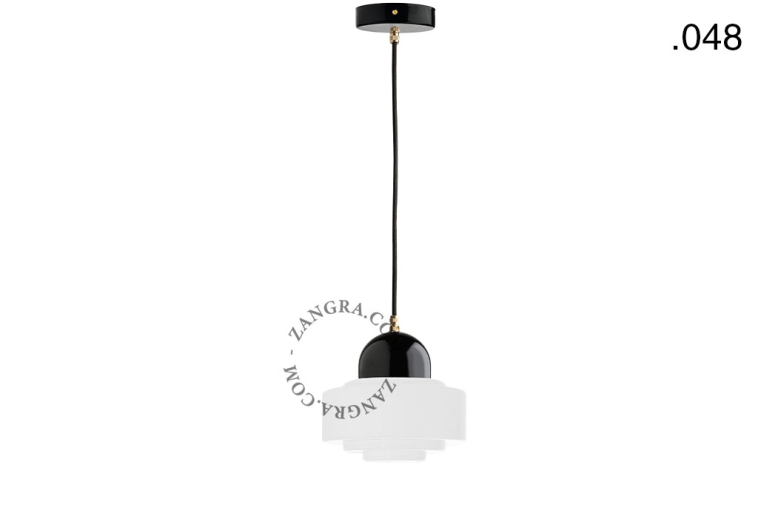 Black porcelain pendant light with glass shade.