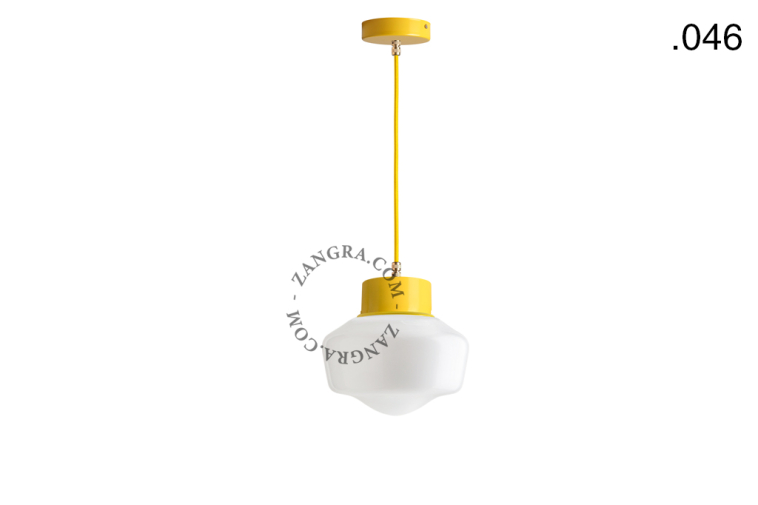 Yellow pendant light with glass shade.