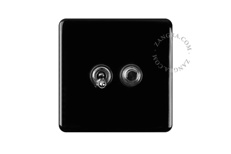 Black porcelain square-shaped switch.