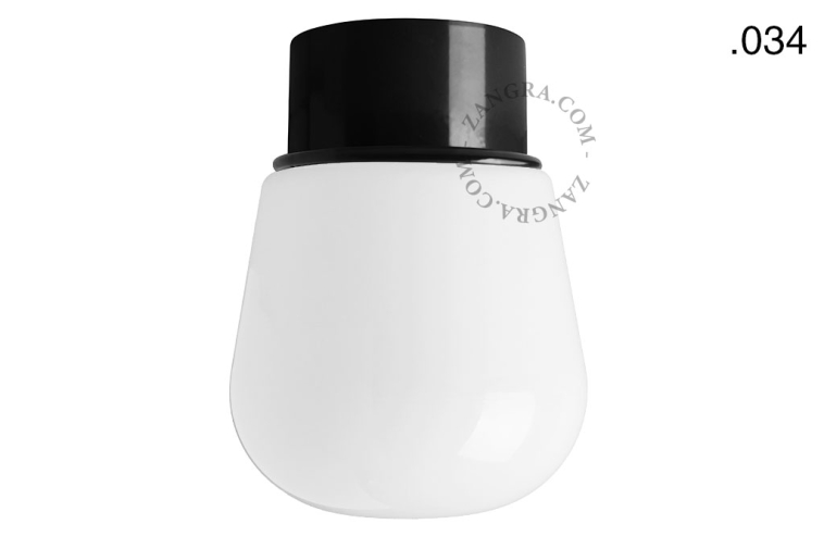 Black ceiling light with glass shade.