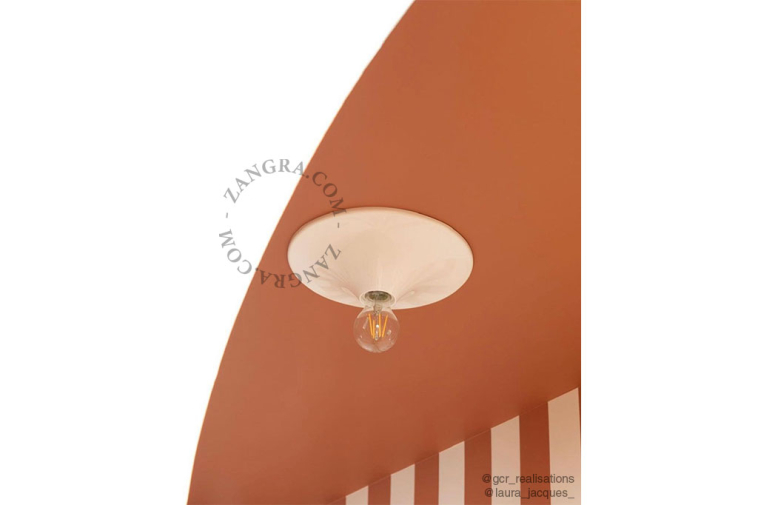 Round white wall or ceiling light.