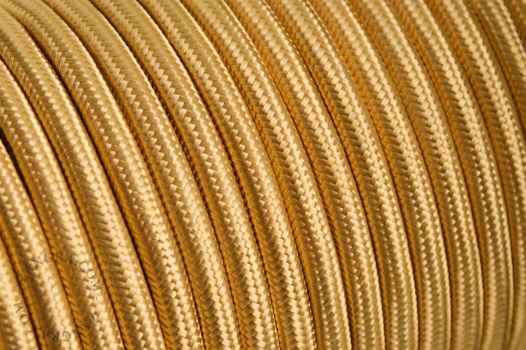 Gold-coloured fabric-covered cable.