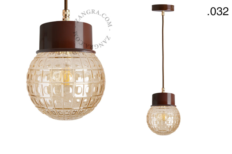 Brown pendant light with glass shade.