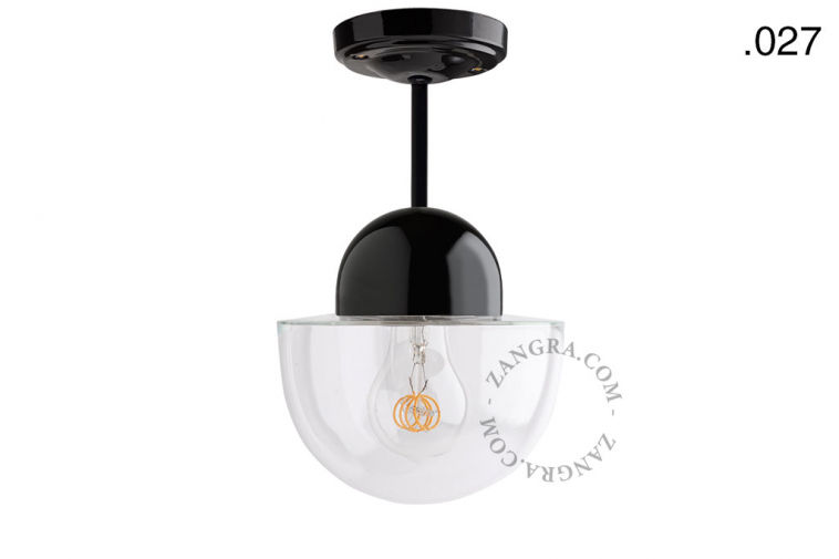 Black porcelain ceiling light with glass shade.