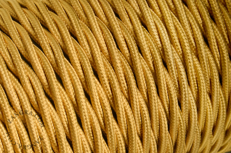 Gold-coloured fabric-covered twisted cable.