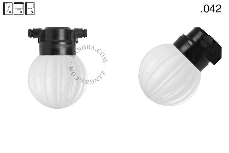 Black wall light with glass globe for outdoor or bathroom use.