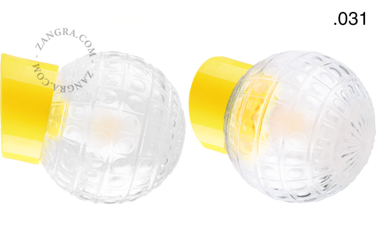Yellow porcelain wall light with glass lampshade.