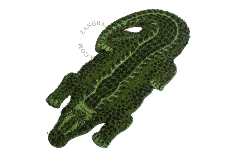 Crocodile-shaped coir doormat.