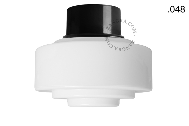 Black ceiling light with glass shade.