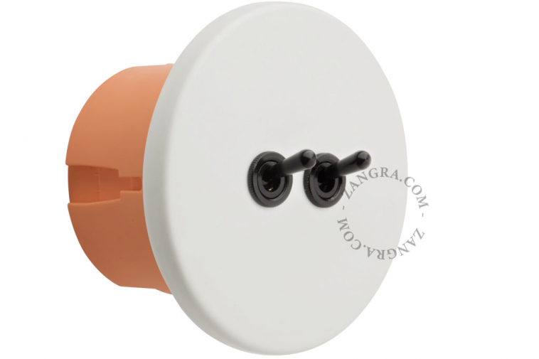 White porcelain switch with double black toggle.