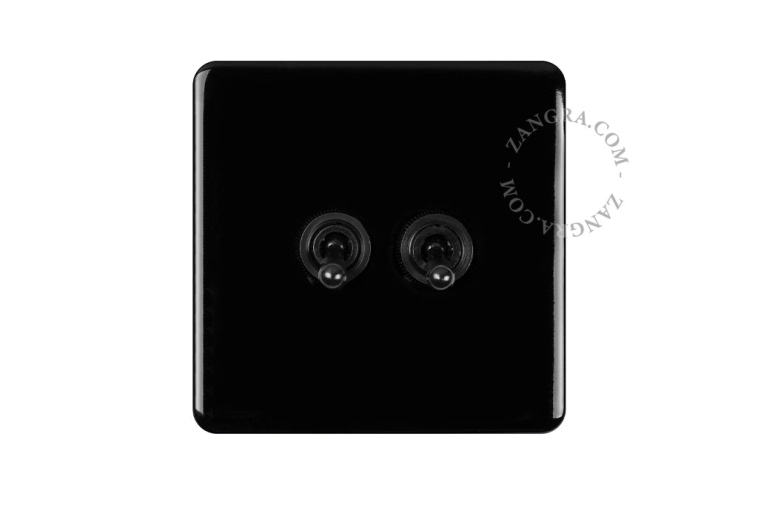 Black porcelain square-shaped switch.